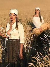 A mature woman with a smile removes her suggestive lingerie