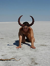 Standing on laps naked on the salt of the salt lake Elton