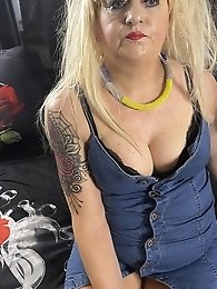 A girl with a sexy figure takes off her sports bra to show her boobs